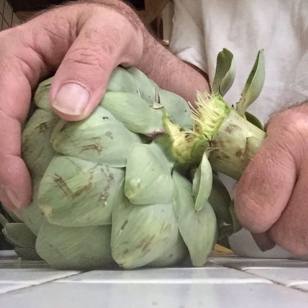Cut the stem of the artichoke(s). Wash the artichoke(s) (put it several times under water).