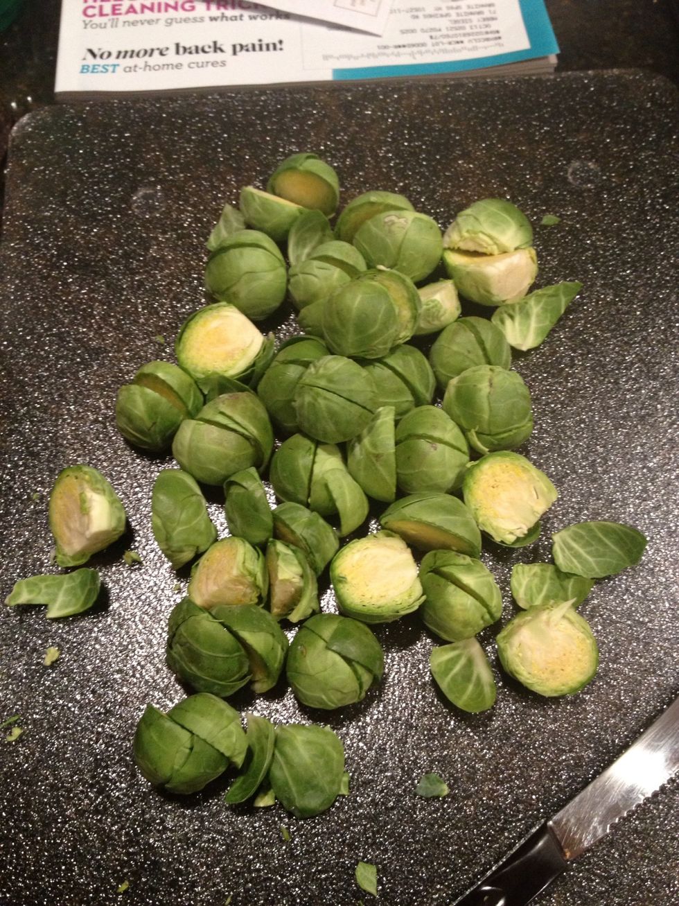 Cut the 'stems' off and cut the sprouts in half.