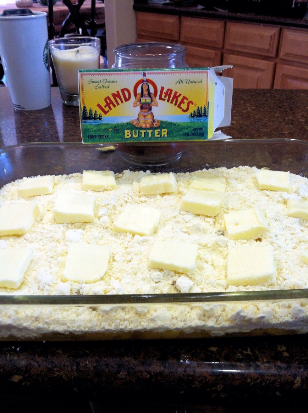 Cut the stick of butter into 16 pieces. Lay the pats of butter over the cake mix