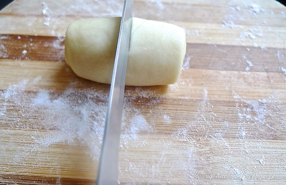 Cut the Swiss Roll shape dough crosswise in the centre.