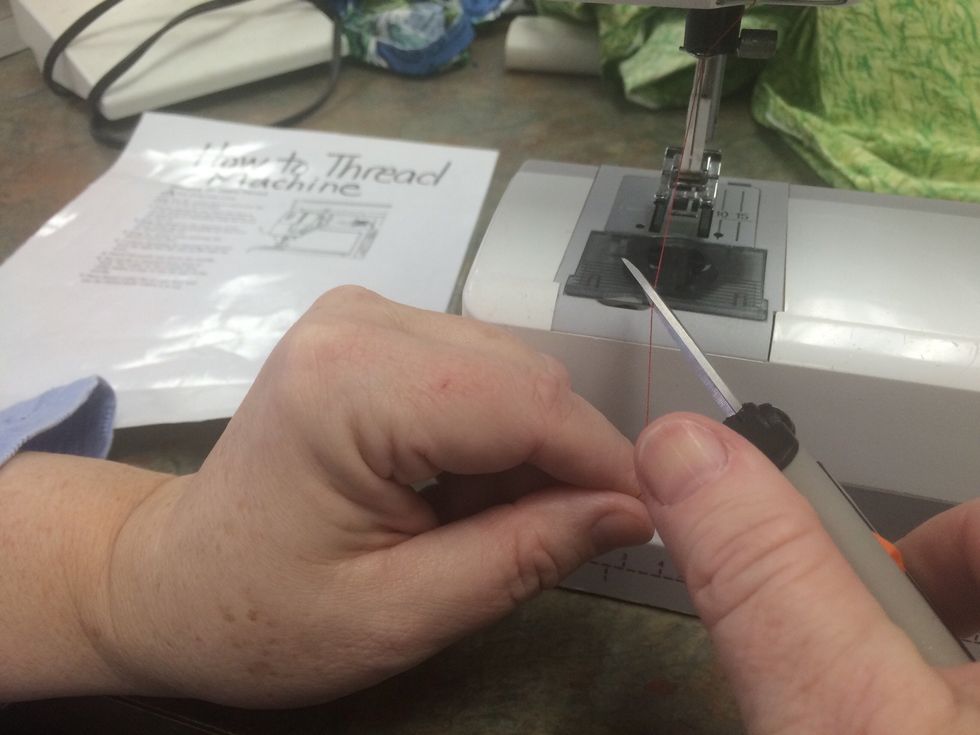 Cut the thread on an angle so it slides through the eye of the needle more easily