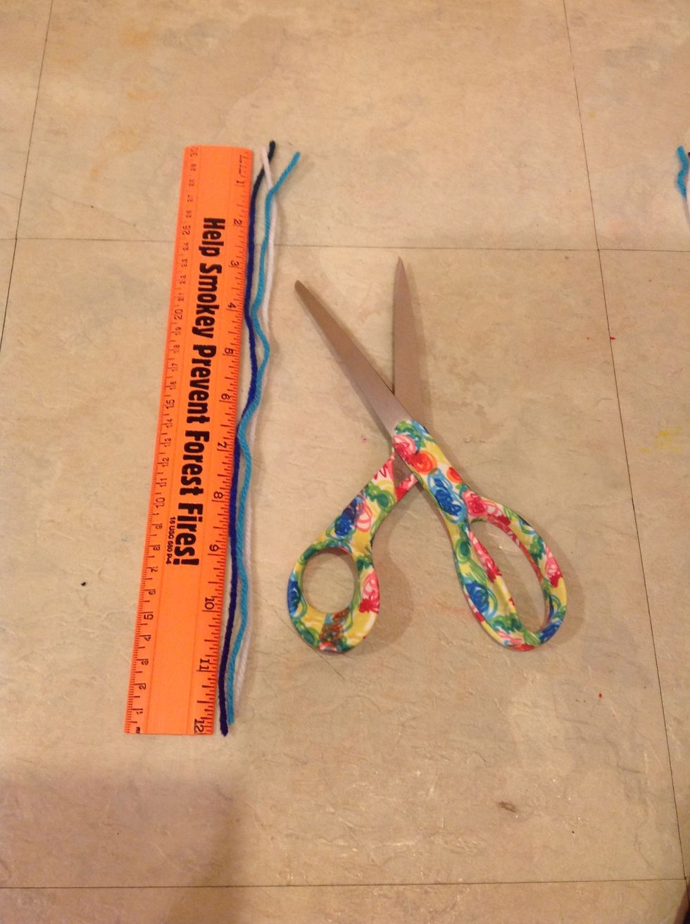 Cut the three pieces of yarn so they are about 12 Inches each