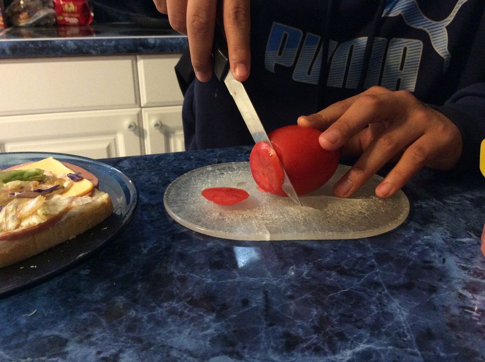 Cut the tomato but your only gonna need two slices.