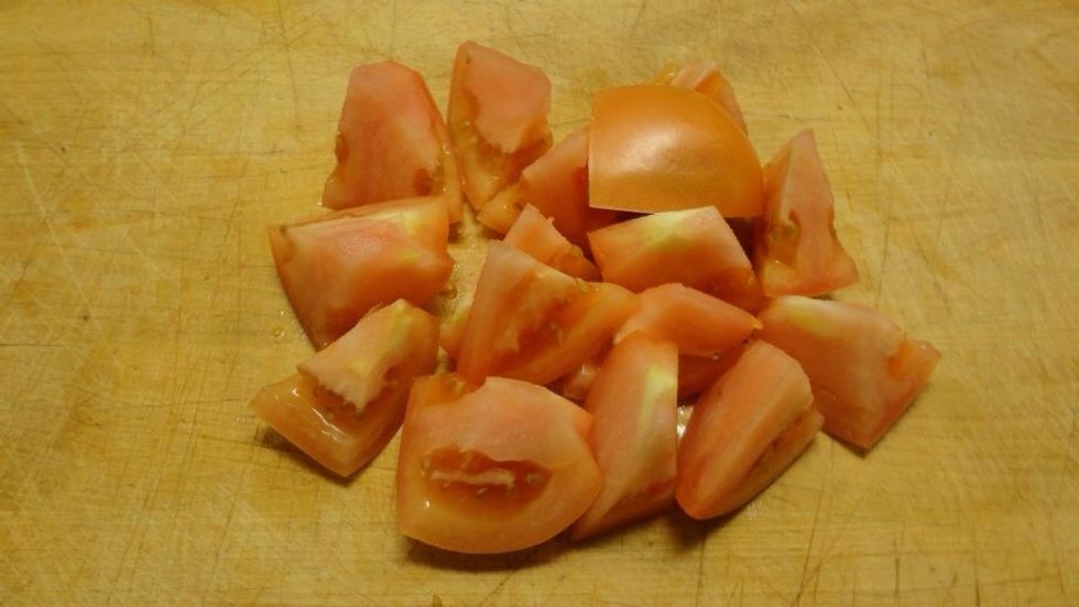 Cut the tomatoes in 1/8s. Keep the juices.