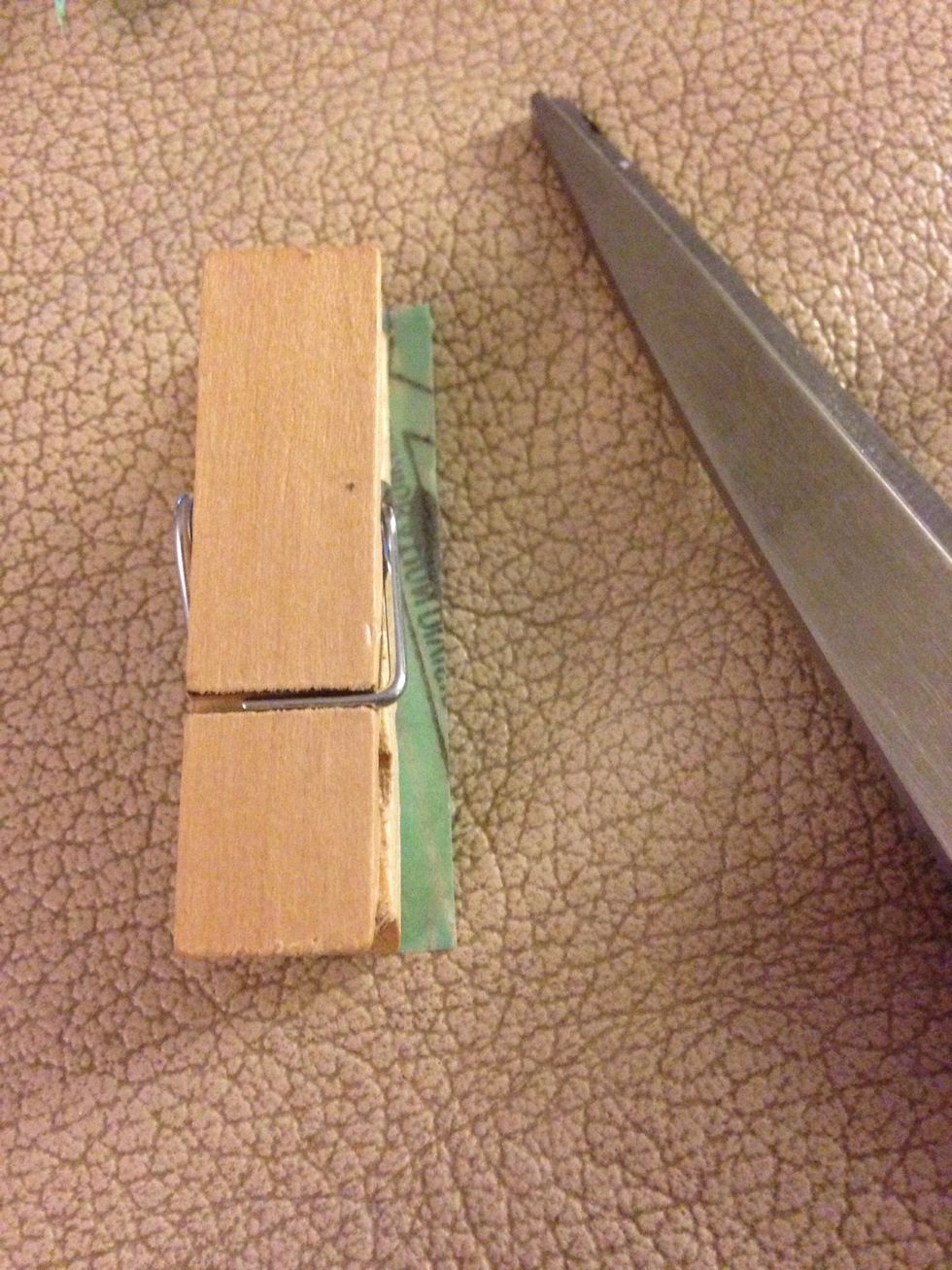 Cut the top and then trim the leftover side.
