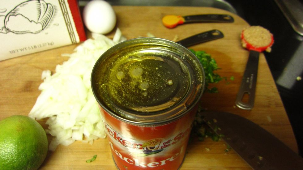 Cut the top of the Mackeral can most of the way but leave 5% of the top still attached. This allows you to leave the fish in the can and drain the fish oil water to saut\u00e9 the onions and spices.
