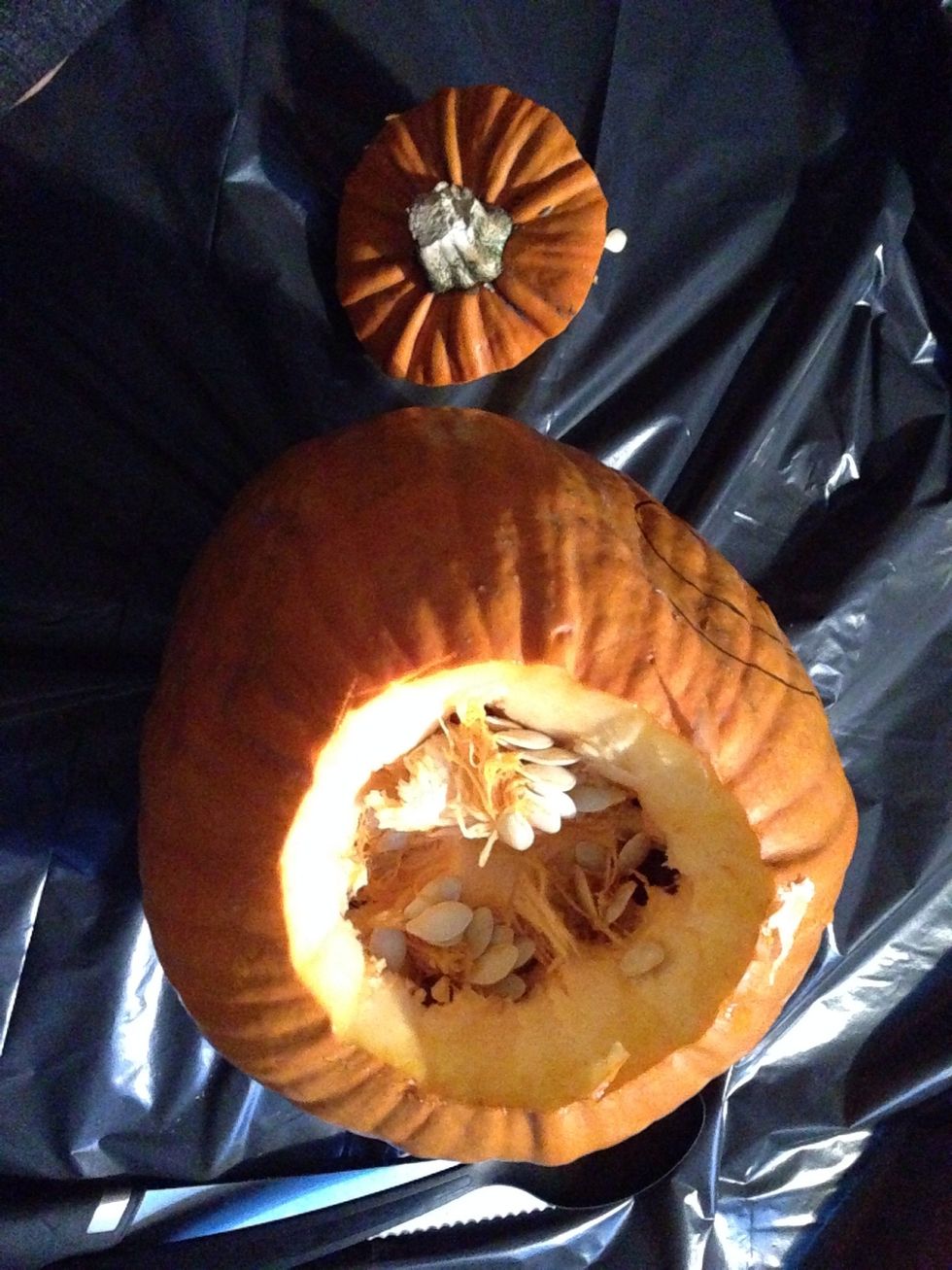 Cut the top of the pumpkin, do it in a angel so you can put the top back on whiteout it going right through.