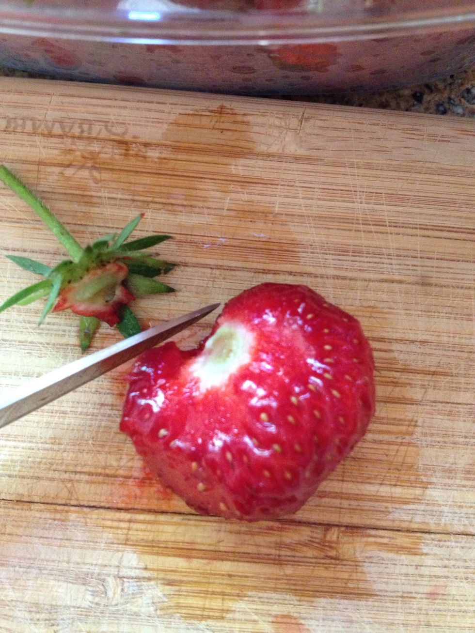 Cut the top off carefully to preserve as much of the berry as possible ;)