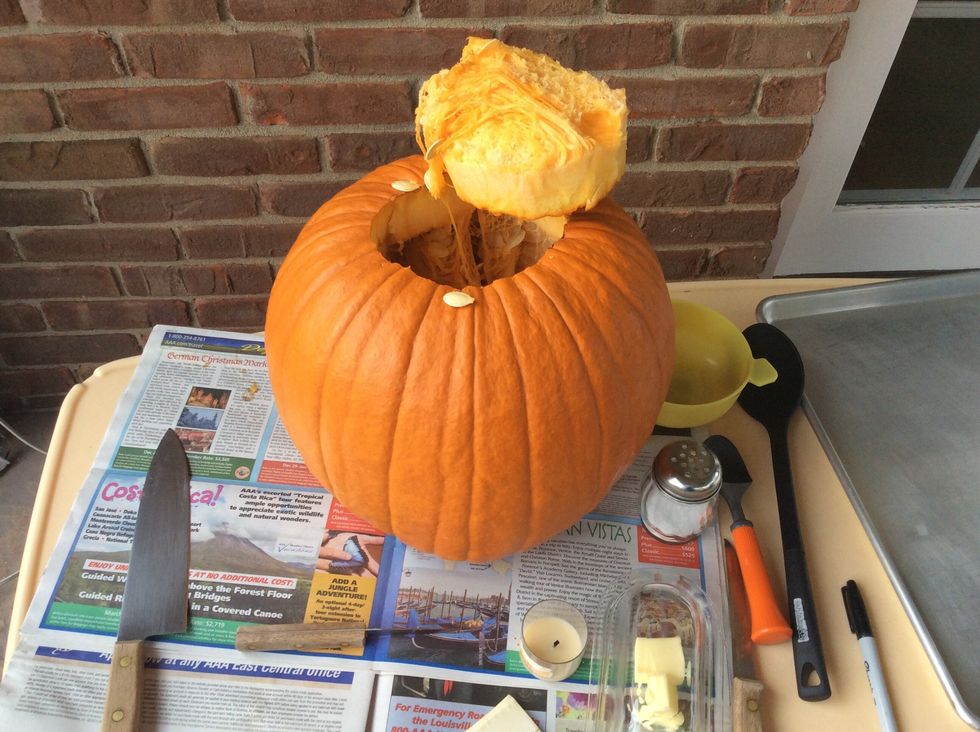 Cut the top open with the larger knife.