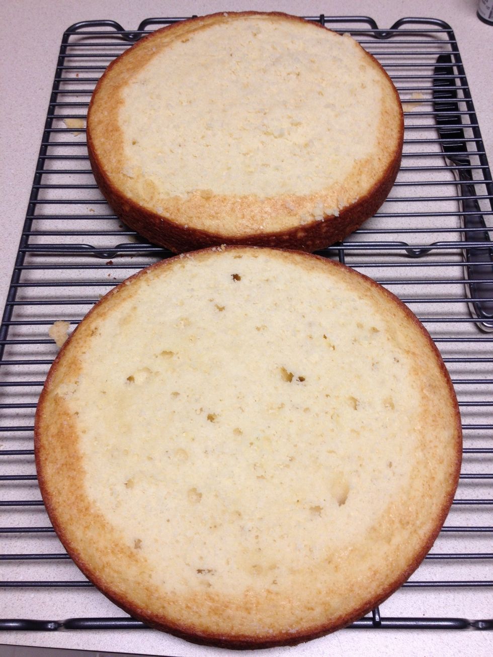 Cut the tops off of the cakes to level them