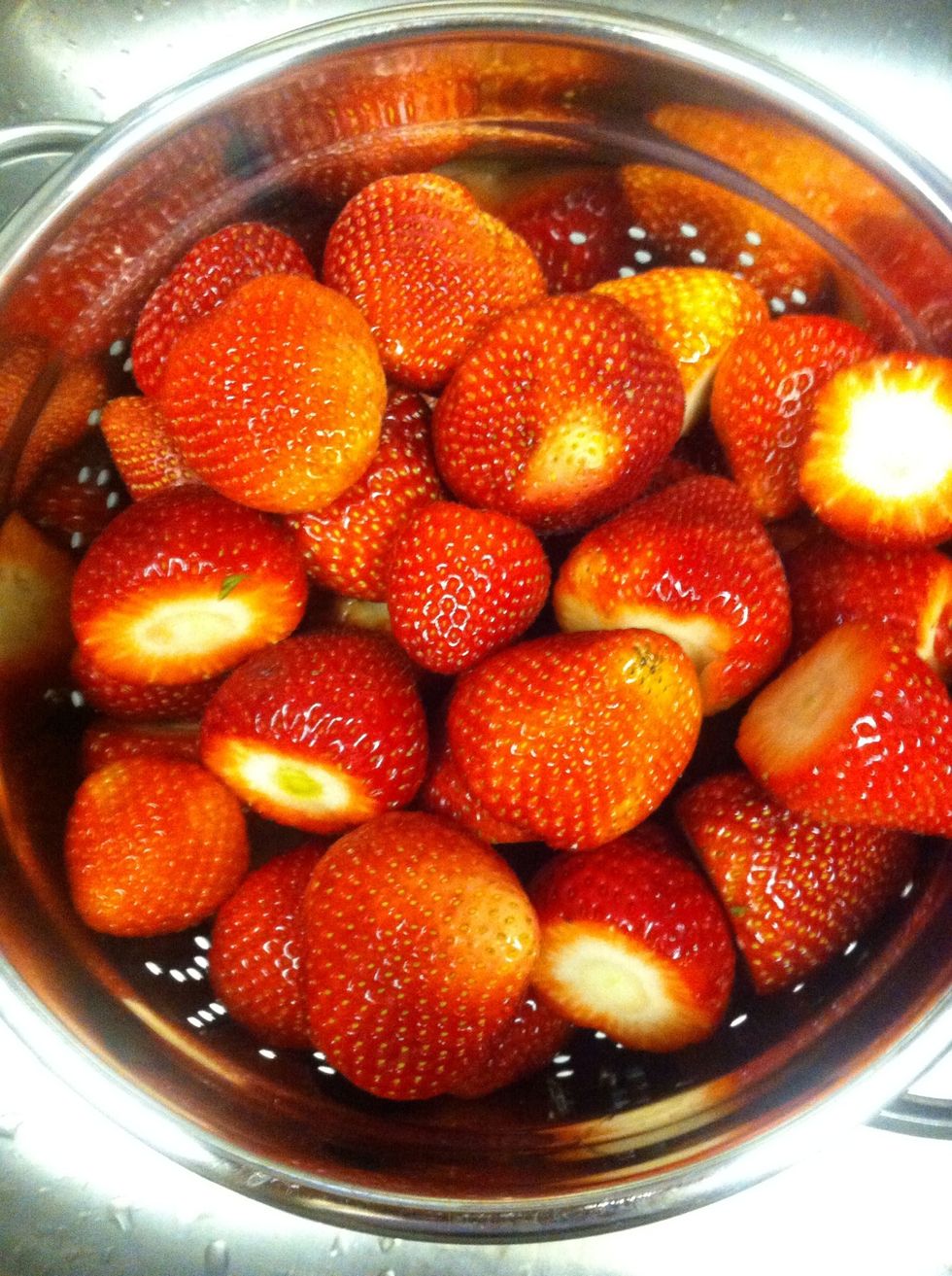 cut the tops off of the strawberries