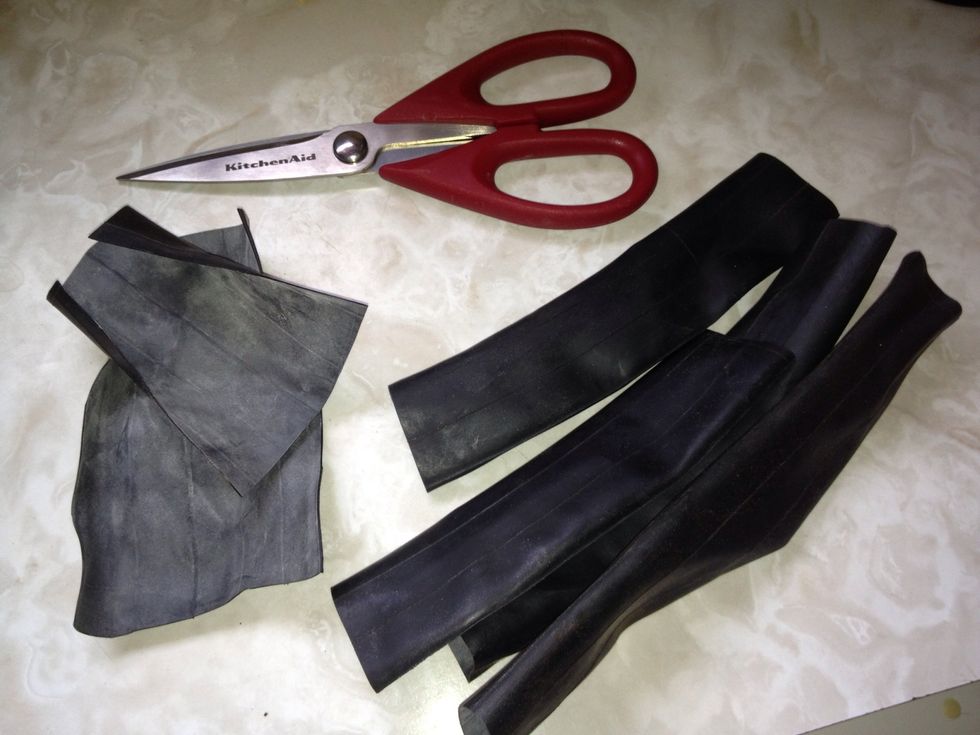 Cut the tubes into smaller pieces, and then cut each tube open.