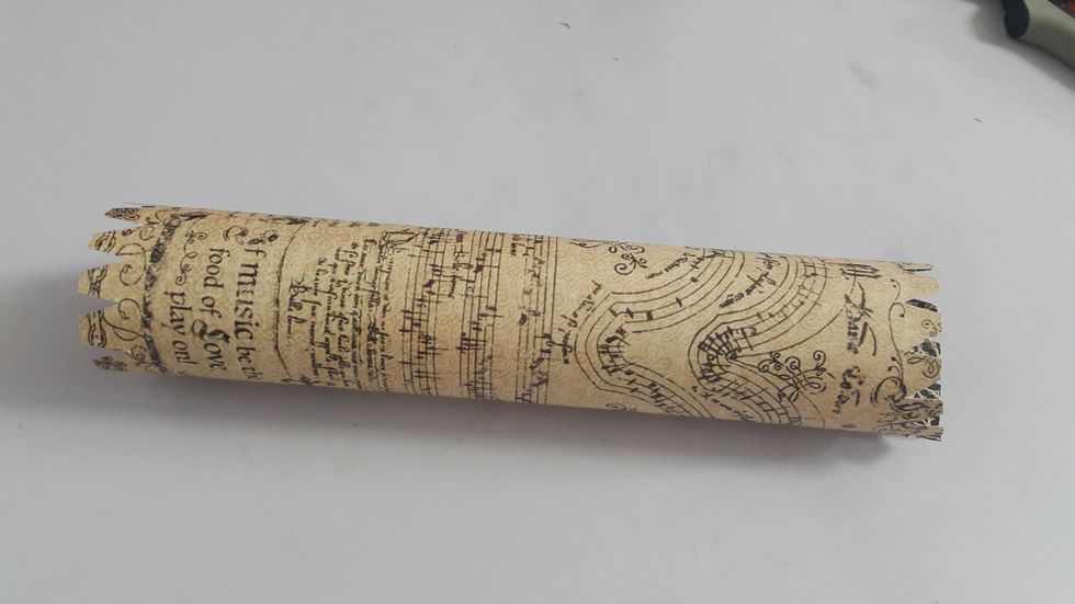 Cut the two ends excess paper into parts which help to adhere all the parts of the project together