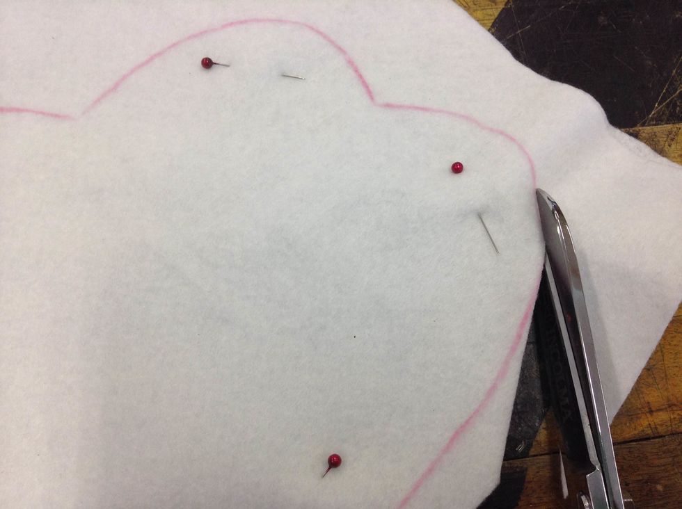 Cut the two layers of felt together using fabric scissors.