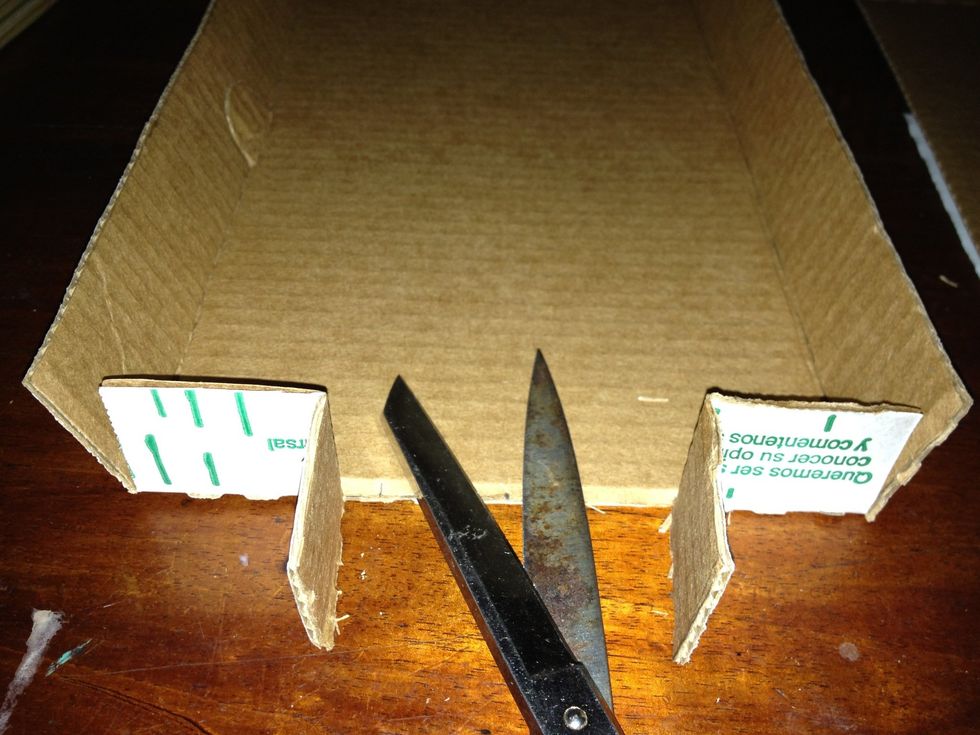 Cut the two short tabs and make like show you at picture