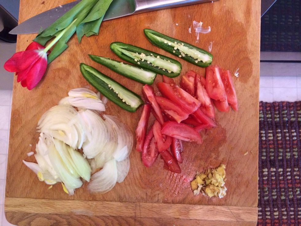 Cut the veggies, chop the garlic+Ginger while the eggplant is in the oven. Keep baking till the eggplant is soft and cooked. You know it's ready if you can easily break the skin from the poke of fork.