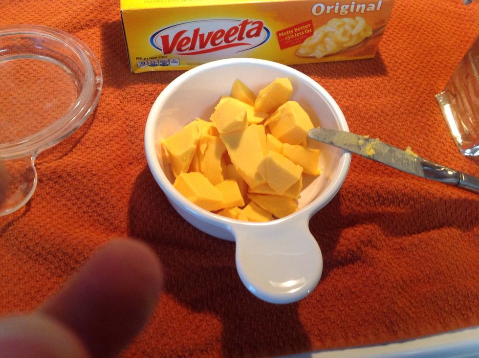 Cut the Velveeta cheese into smaller pieces so it can melt better