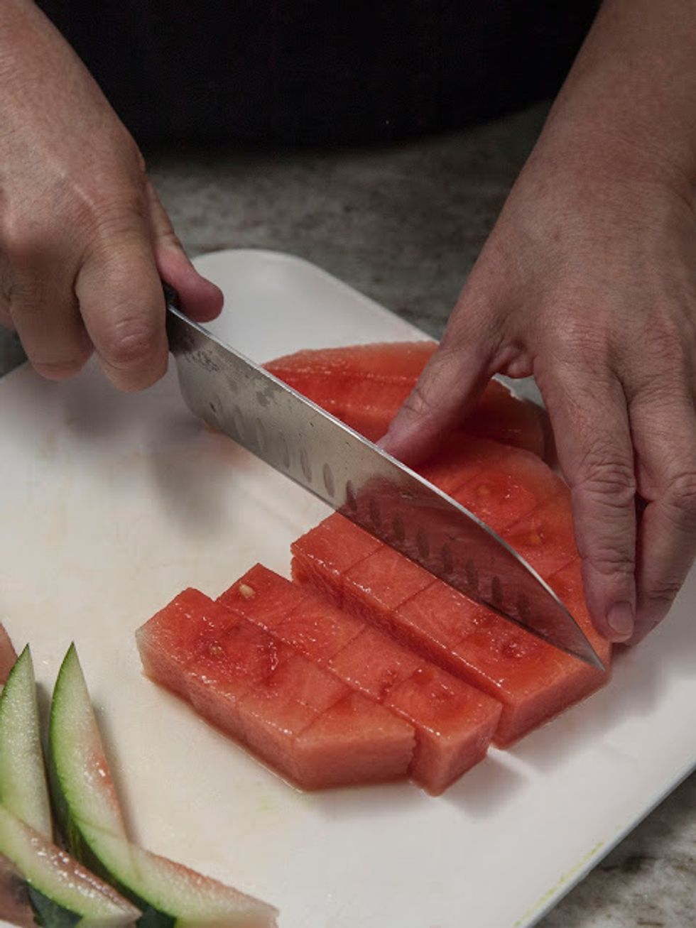 Cut the watermelon into cubes.