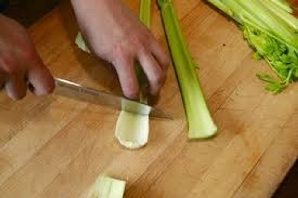 Cut the white end of the celery on an angle to keep as much green as possible. Also cut the other end where the celery branches off.