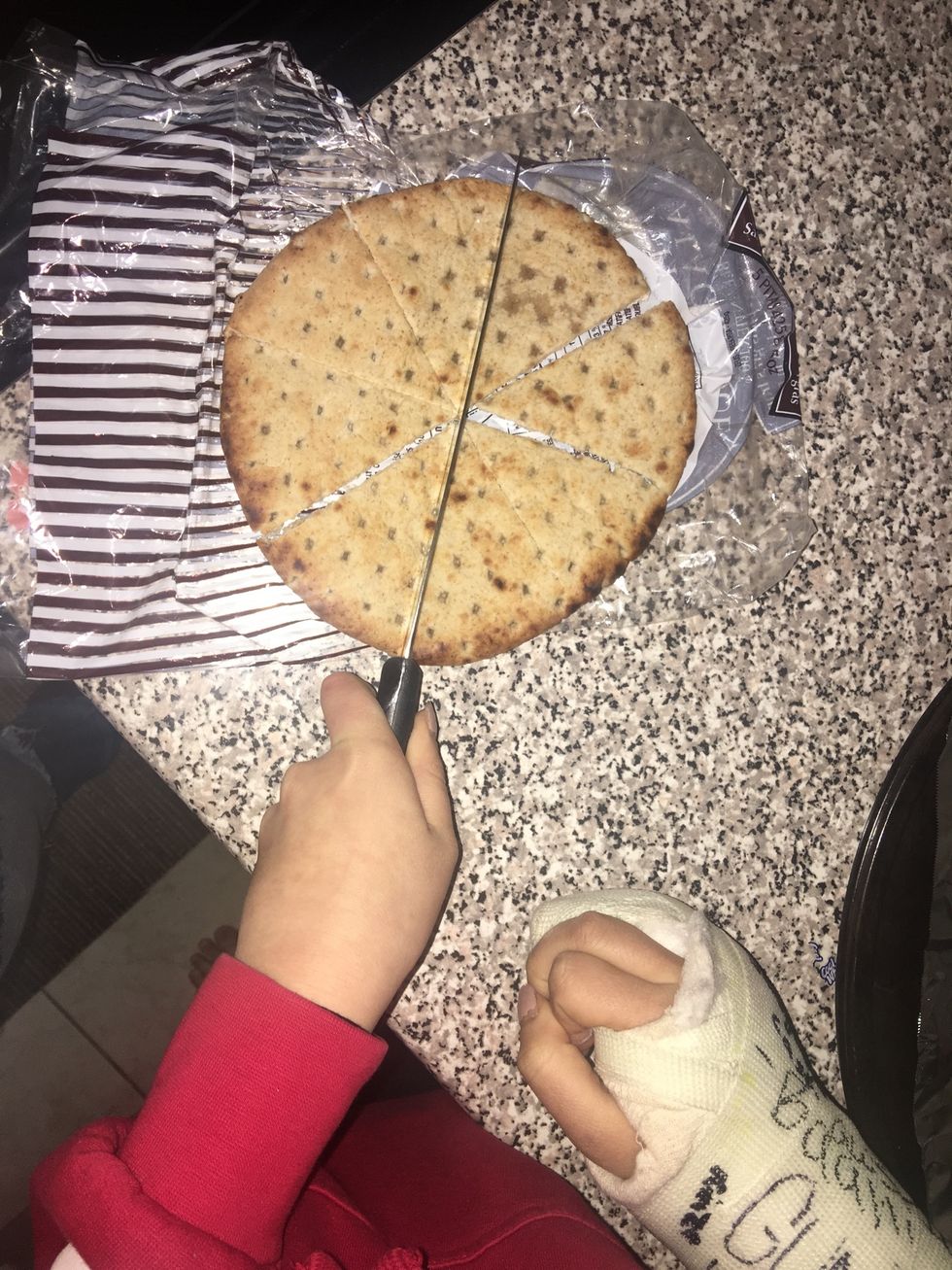 Cut the whole wheat pita bread into about 8 triangle pieces.
