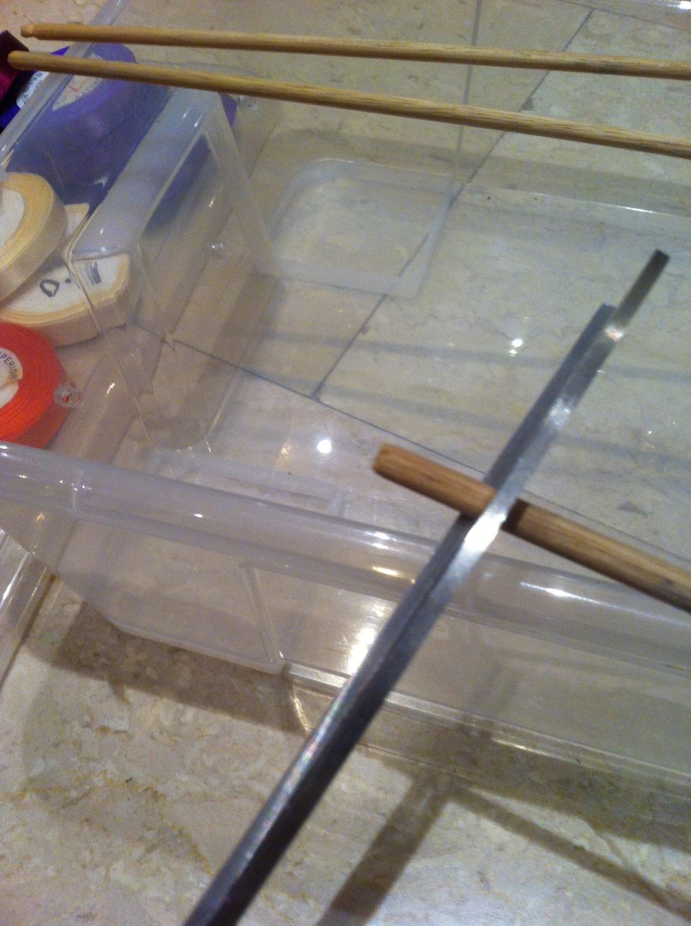 Cut the wooden stick 3 equal size bigger than the box so you can see them from the side