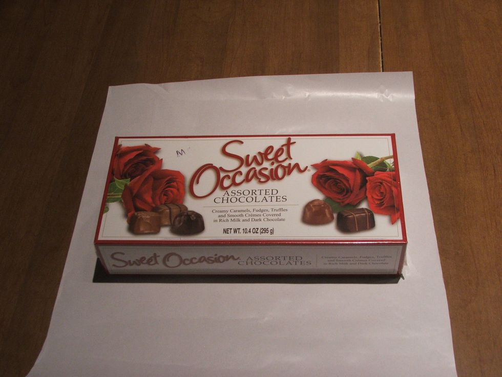 cut the Wrapping Paper to proper size to fit the box.