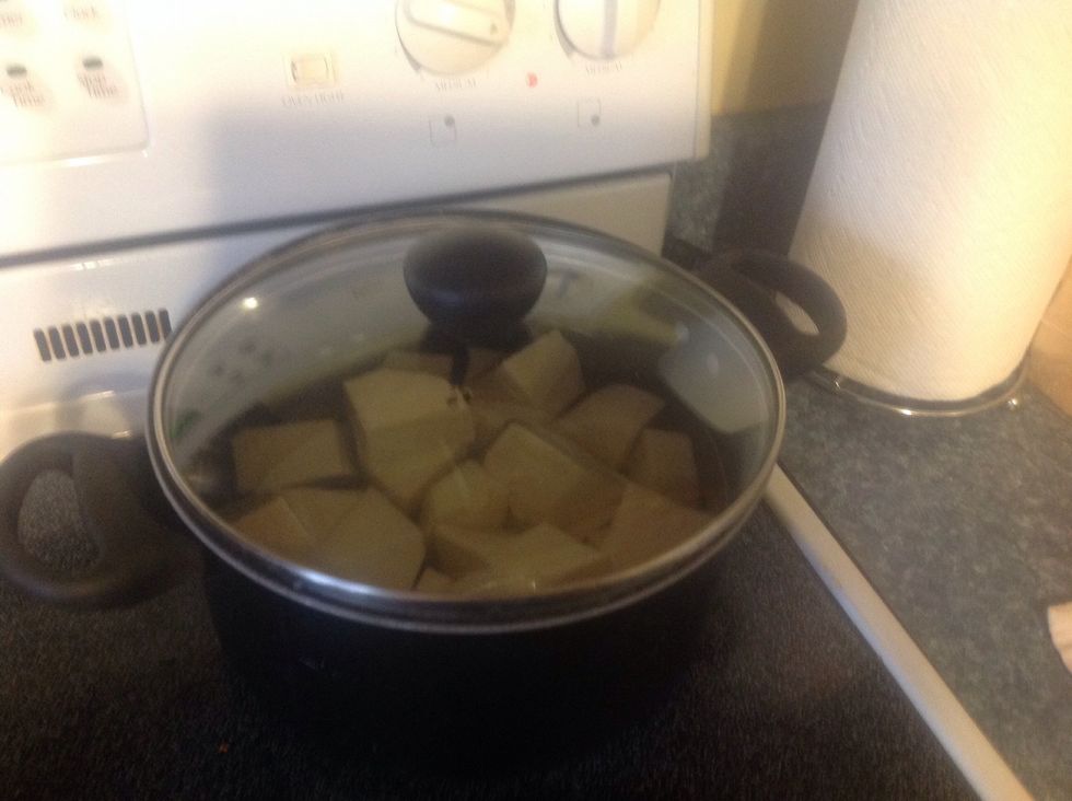 Cut the yams into quarters and add water slightly over the top and cover on med high heat til boiling.