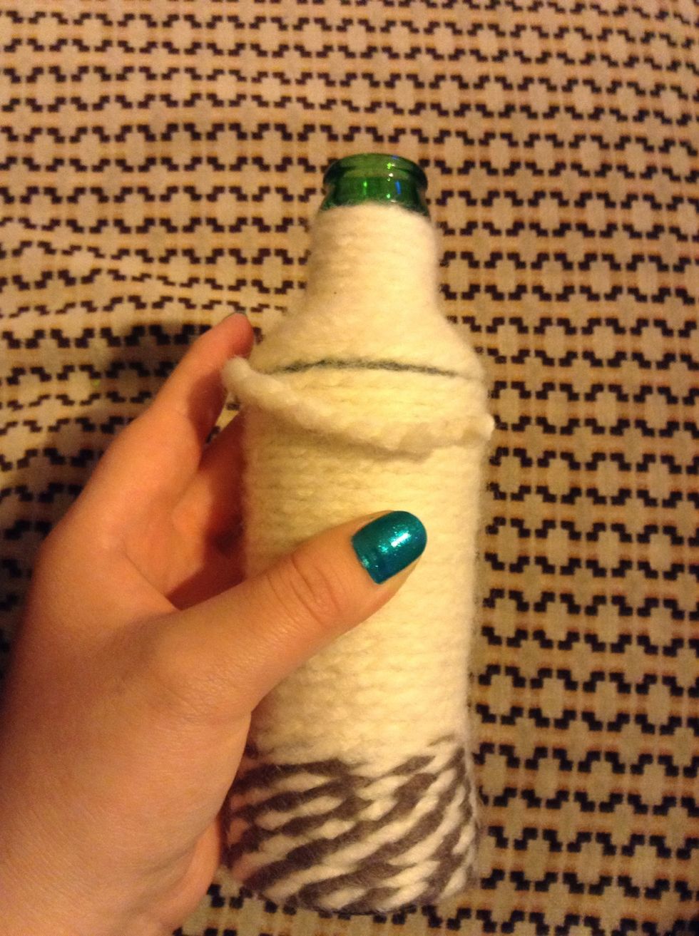 Cut the yarn and add some superglue were you are going to glue the string down.