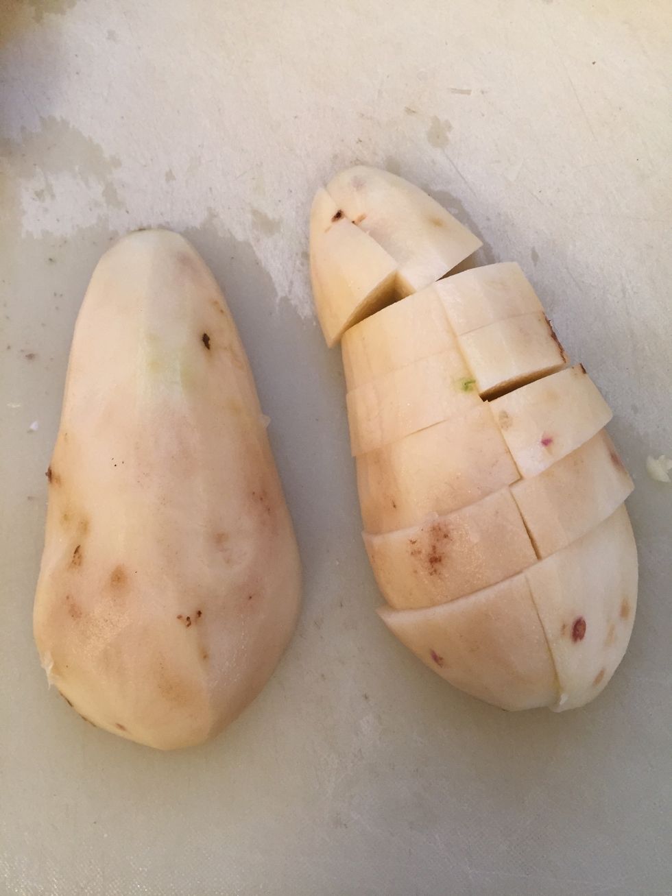 Cut them as shown. (This potato has already been cut in half length wise)