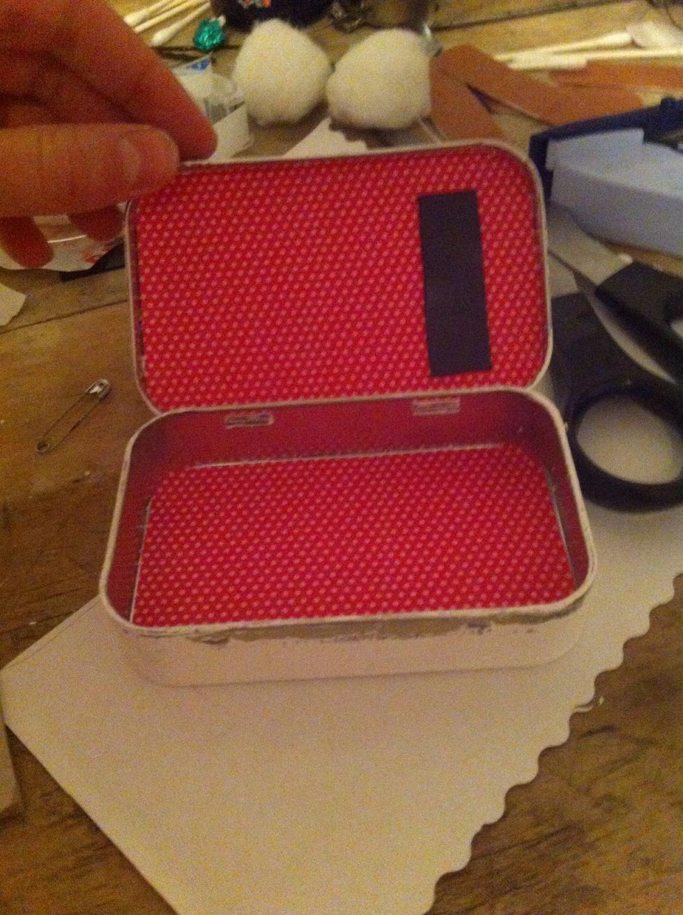 Cut them both out and glue them into there places inside the tin and measure and cut a magnet to fit onto the top of the tin inside