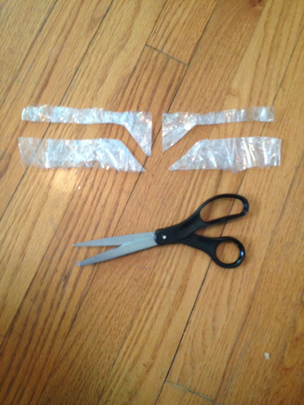 Cut them like this. Looks like some cool logo from a sci fi movie. DO NOT discard the lower halves.