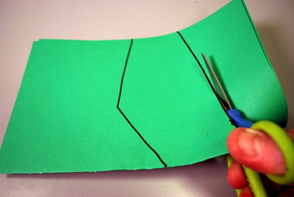 Cut them out of the same piece of folded paper