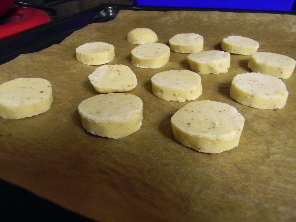 Cut them up and put each cookie about a finger-width apart from each other on an ungreased cookie sheet. I like to use parchment paper because it makes the cleaning easier, but it's not necessary.