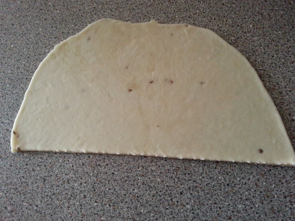 Cut these ovals in half and fold them to make cones, as shown in the pictures. Seal the edge with some water and press it to close it tight