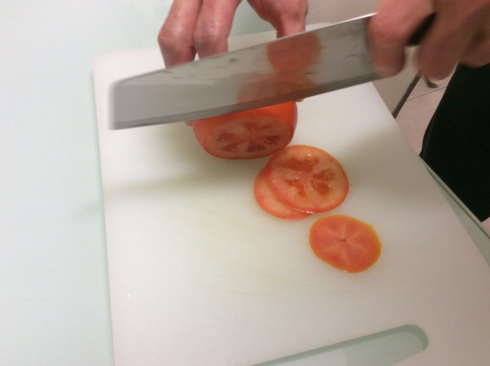 Cut thin slices of tomato