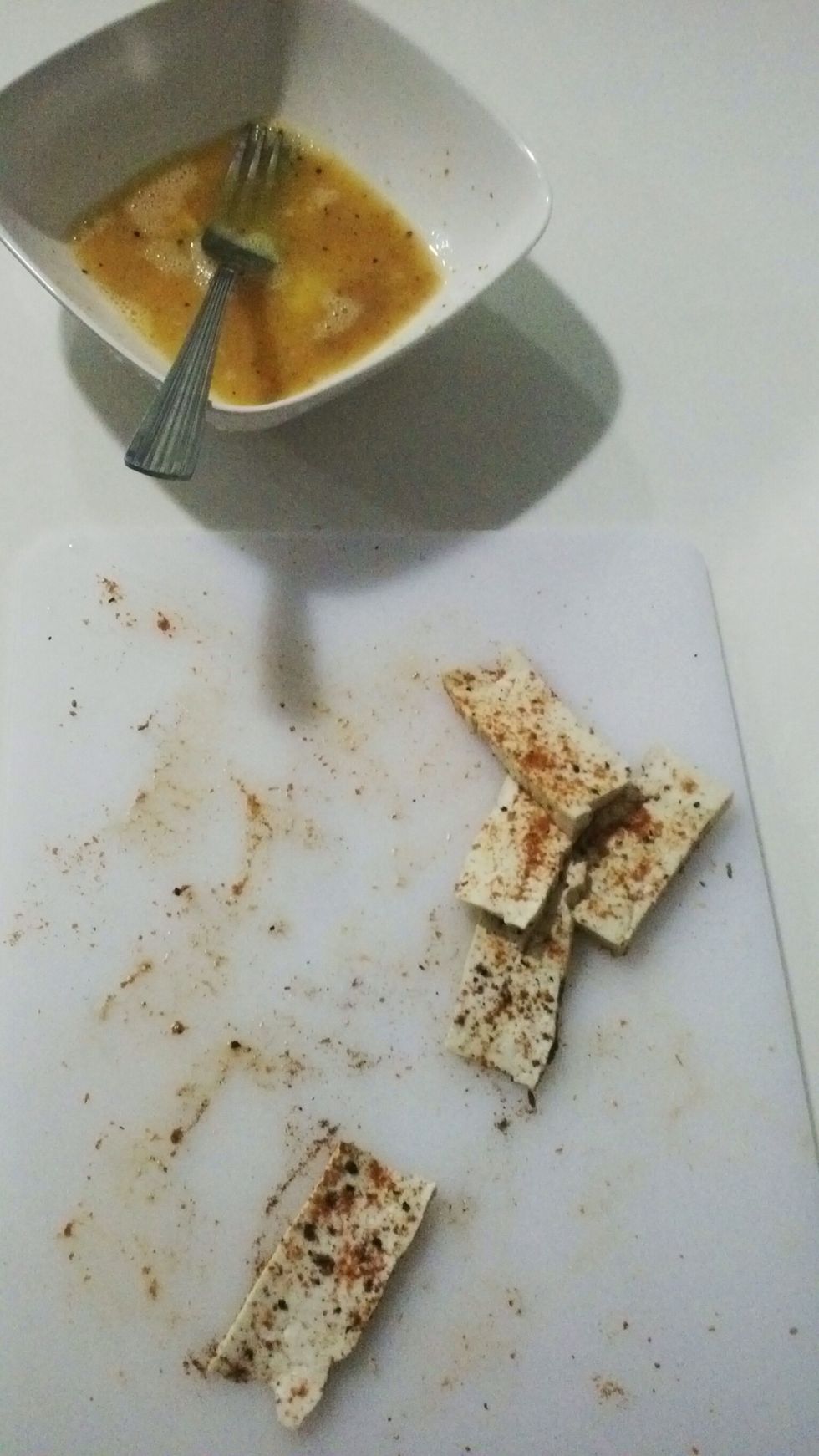 Cut tofu into rectangular strips and coat with dry spices