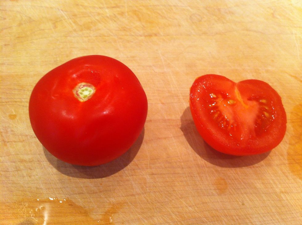 Cut tomato in half, top down so you cut through whee the stem was.