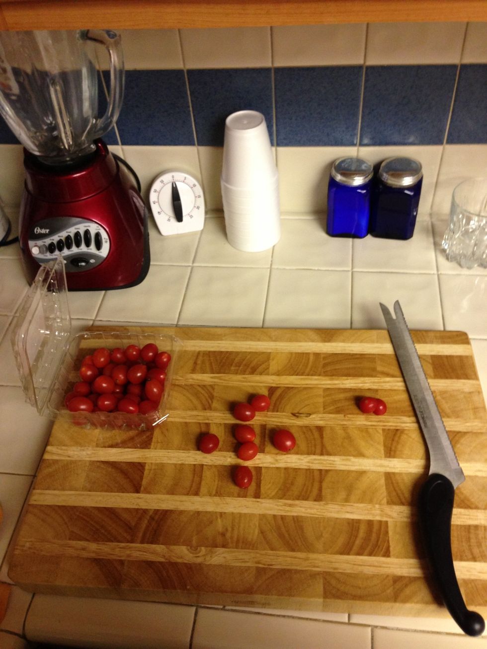 Cut tomatoes in half. I usually use big tomatoes but I was out so I'm substituting!