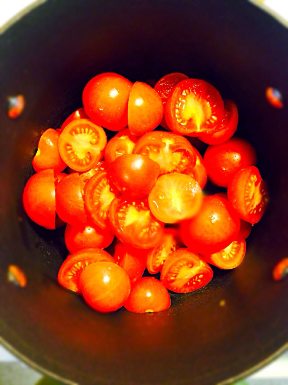 Cut tomatoes in half. Place them in the cooking pan. Use very red and ripe tomatoes. The tomatoes you'll pick are the only color makers as no canned tomato products used in this recipe