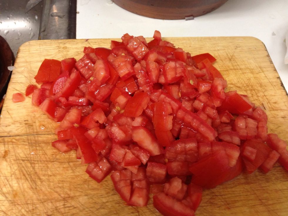 Cut tomatoes in to little pieces