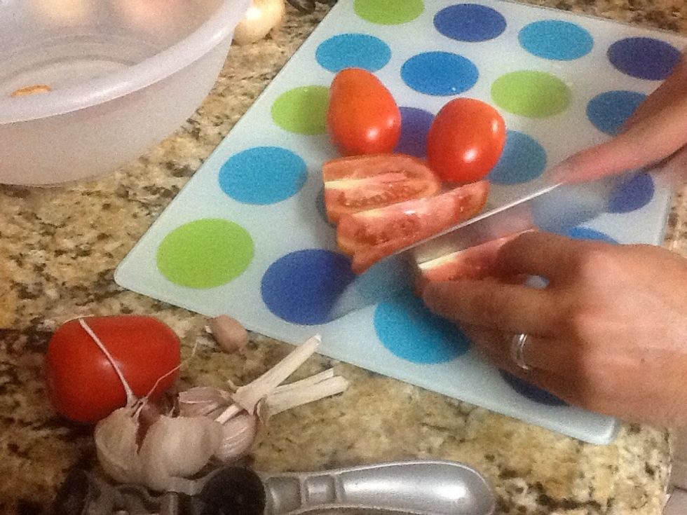 Cut tomatoes into wedges.