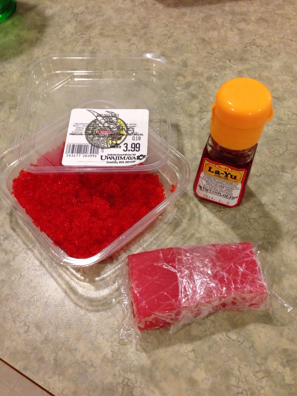 Cut tuna in small pieces and add chili oil and Tobiko.  More oil=more spicy