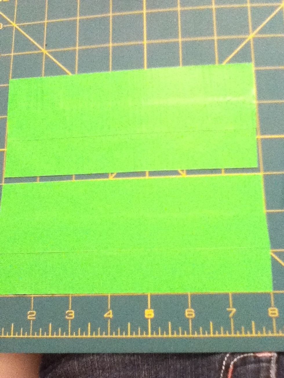 Cut two 3inch by 7inch pieces of green ductape. This can be acheived by overlapping two strips of ductape.
