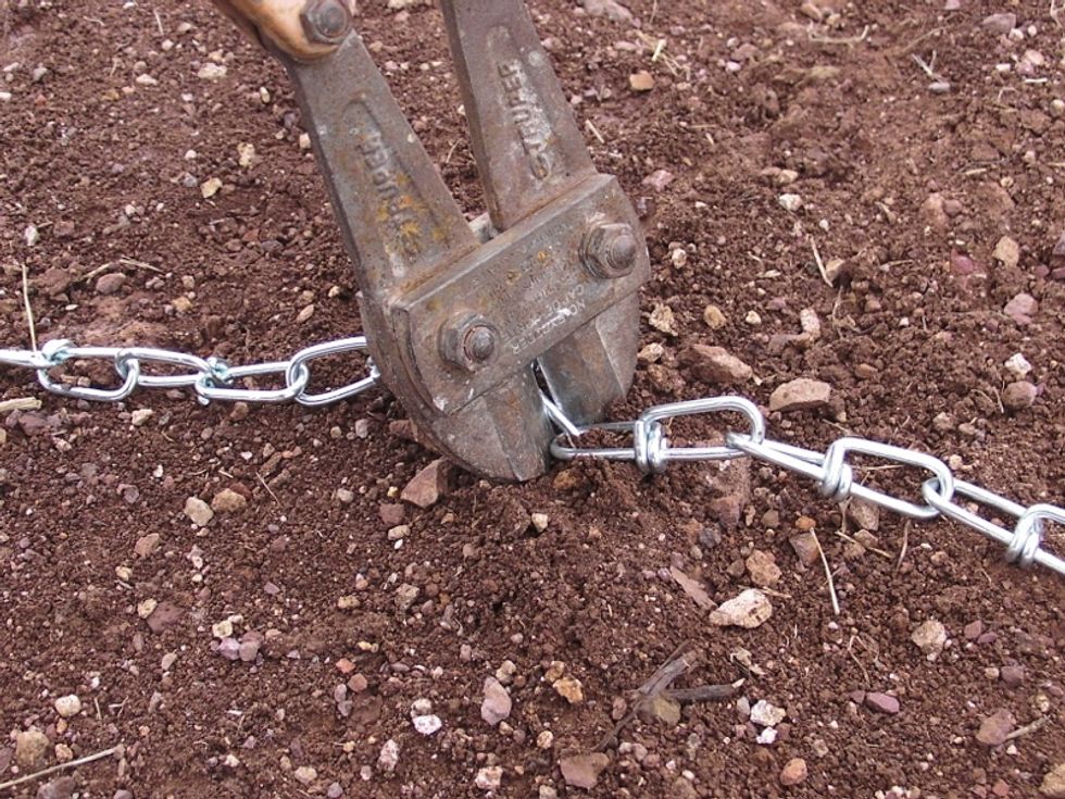 Cut two equal lengths of chain. Each should be long enough to go from the holder (at whatever height you want it), up to the ceiling, and then back down to the holder.