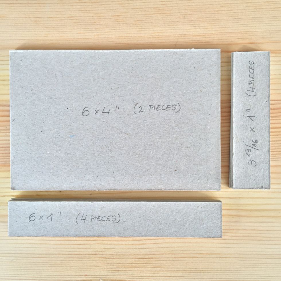 Cut two pieces of 6" x 4\u201d, four pieces of 6" x 1\u201d and four pieces of 3 13/16" x 1\u201d of cardboard to make the box for the mini album.