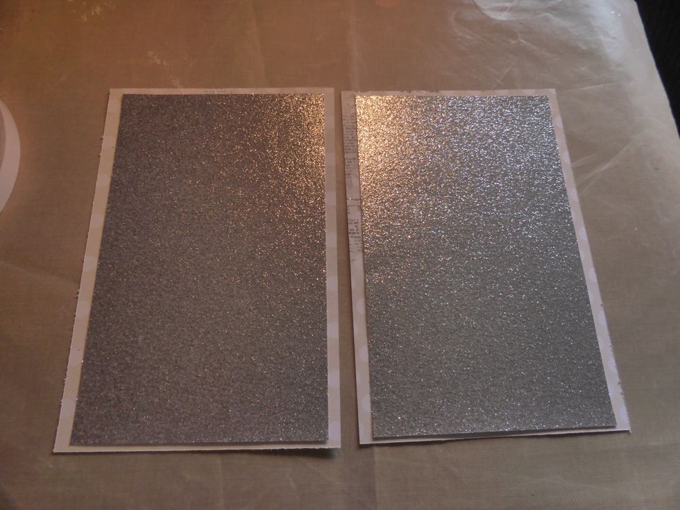 Cut two pieces of the silver speciality paper to 1cm x 17 cm and layer it on top of the Glistening paper