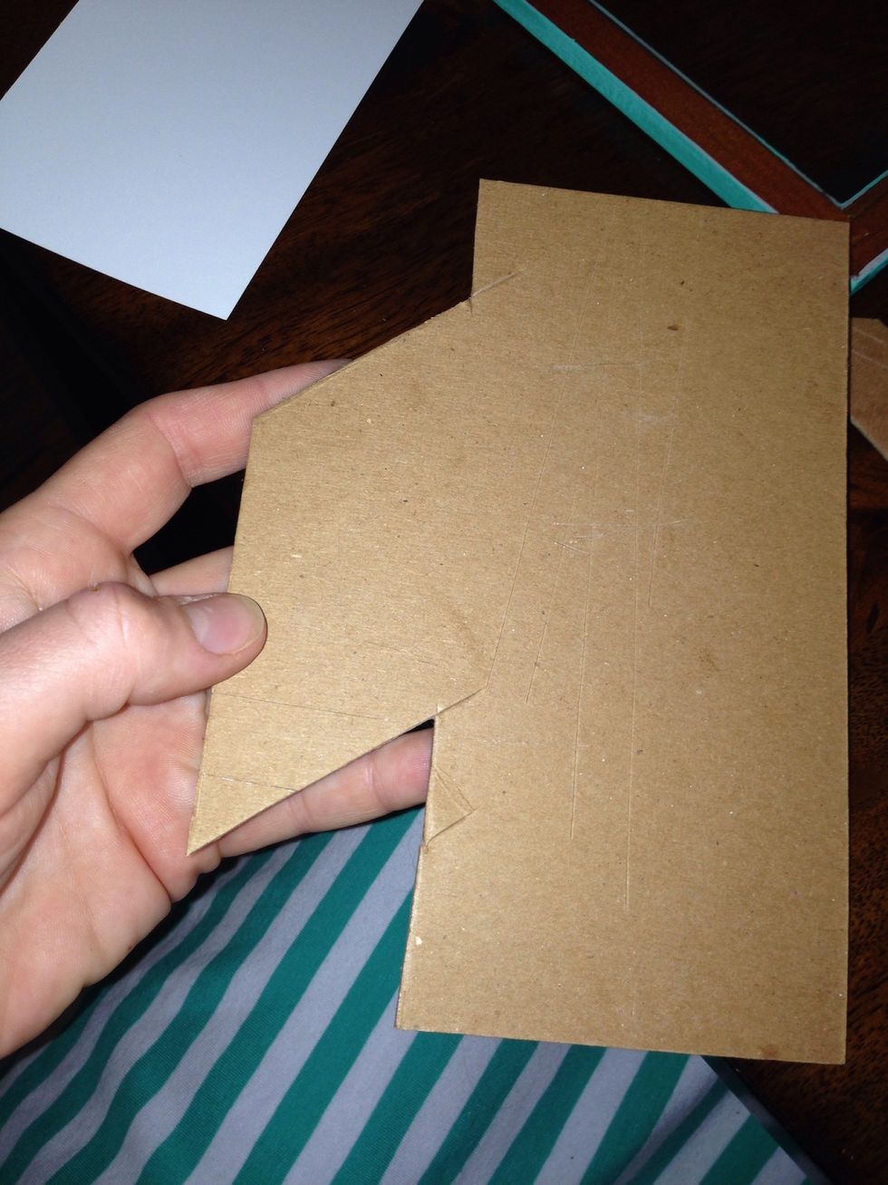 Cut two rectangles. They're not normal ones, I forget the actual name. Some geometrical name that I learned in 5th grade but I can't remember that far back.