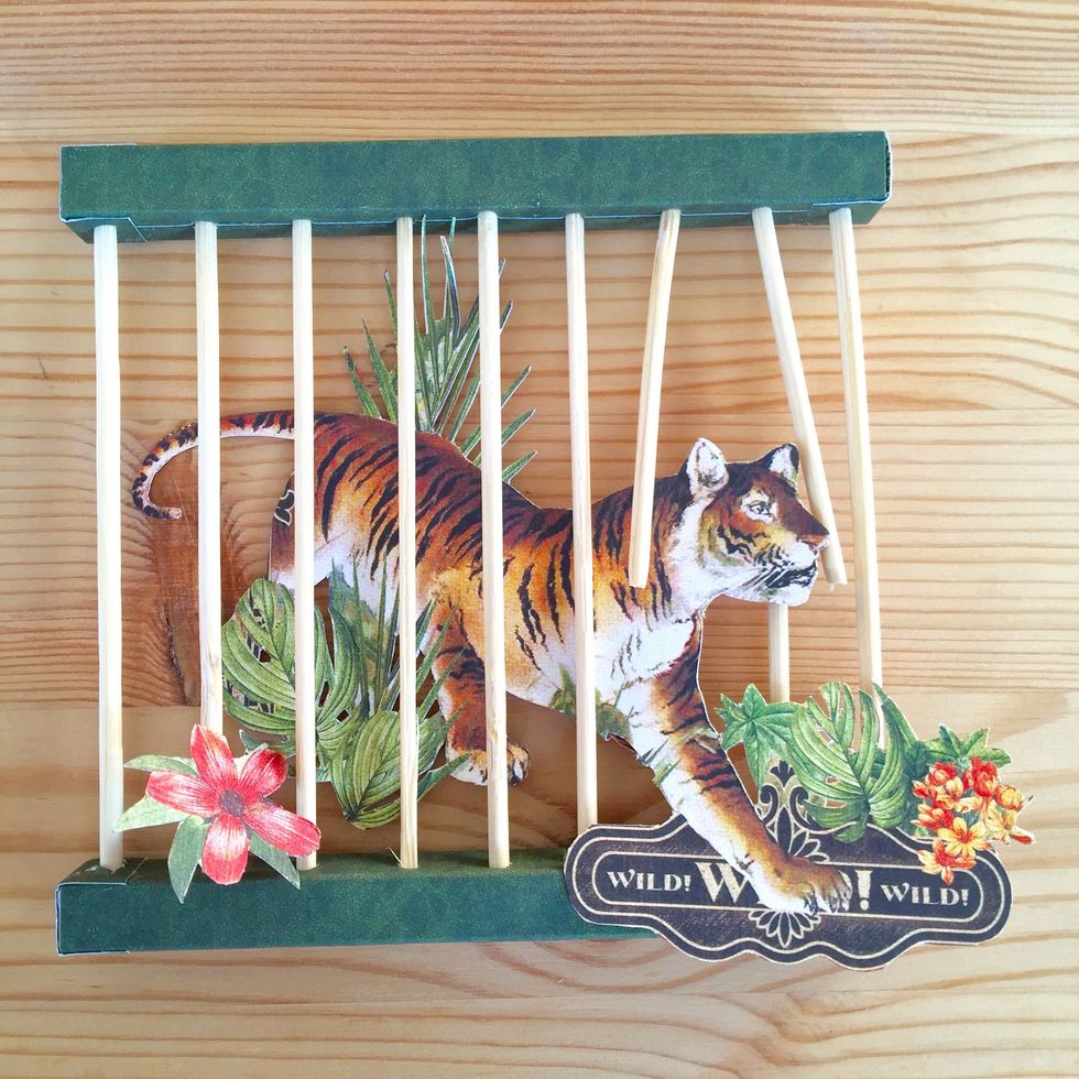 Cut two skewers to look like the tiger escapes from it cage!