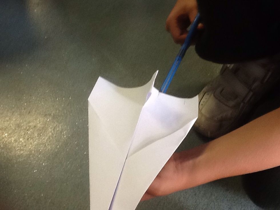 Cut two slits on the wings to make flaps.