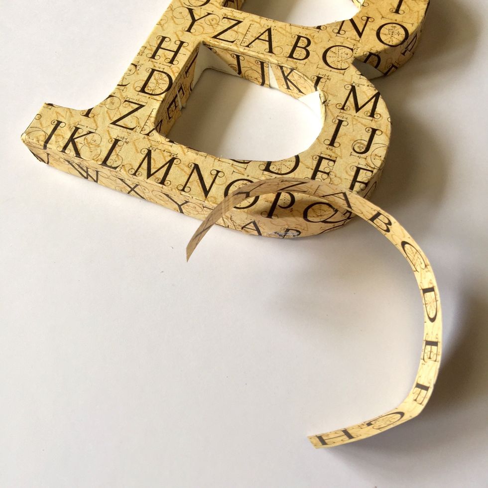 Cut two stripes of paper to cover the areas inside hole that have no paper.